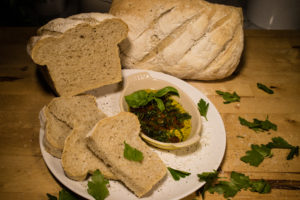 A view of a sliced loaf of my favorite sourdough bread. A view of a sliced loaf of my favorite sourdough bread.