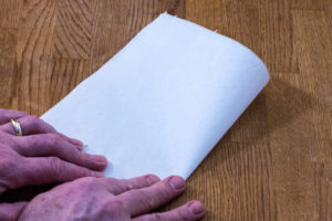 Step 2: Fold the cartouche paper in half again. Step 2: Fold the cartouche paper in half again.