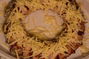 We now see the graded cheese on the Falukorv prior to baking. We now see the graded cheese on the Falukorv prior to baking.