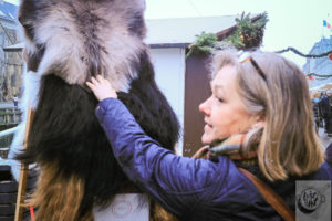 Eva inspecting fur pelts. Eva inspecting fur pelts.