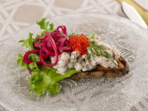 Skagen toast with beet pickled onions and trout roe. Skagen toast with beet pickled onions and trout roe.