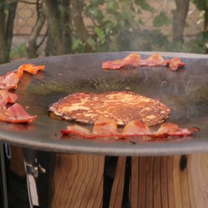 Raggmunk and cured pork belly frying on the Muurikka. Raggmunk and cured pork belly frying on the Muurikka.