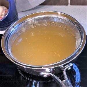 Fish stock heating for poaching the veggies. Fish stock heating for poaching the veggies.