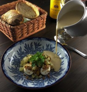 Pouring mussel soup beside the smoked fresh cheese and sautéed fennel. Pouring mussel soup beside the smoked fresh cheese and sautéed fennel.