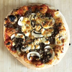 A Swedish Sausage, mushroom, onion and feta pizza. A Swedish Sausage, mushroom, onion and feta pizza.